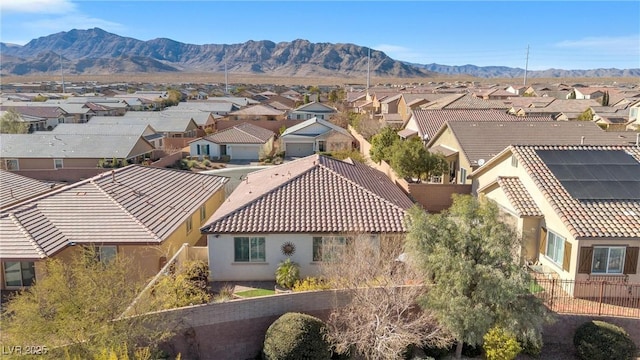 birds eye view of property featuring a mountain view