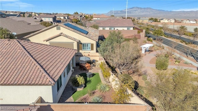 birds eye view of property with a mountain view