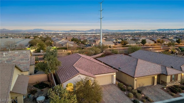 birds eye view of property with a mountain view