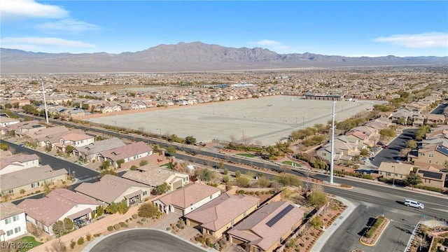 birds eye view of property with a mountain view