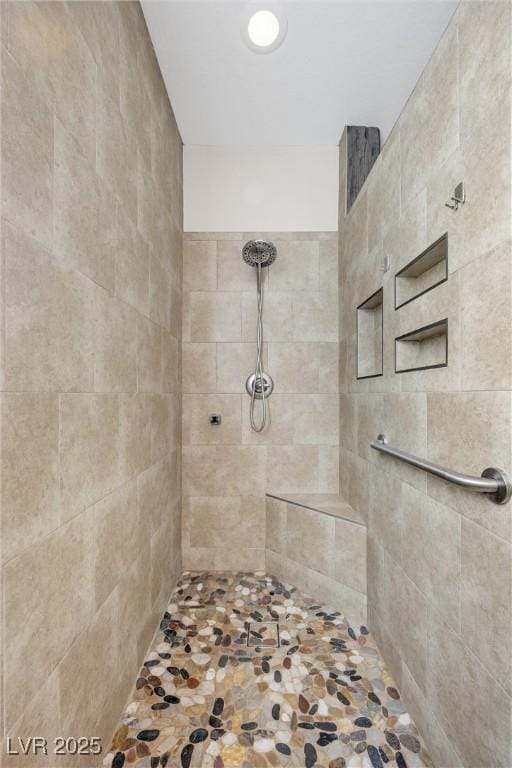 bathroom featuring tiled shower