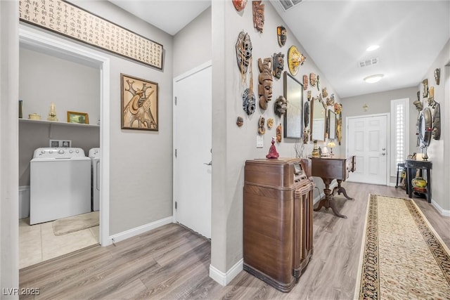 interior space featuring light hardwood / wood-style flooring and washer and clothes dryer