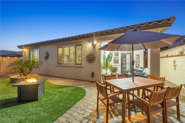 exterior space with a fire pit and a patio area