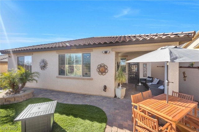 rear view of property with a patio area