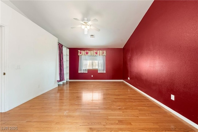 unfurnished room with light hardwood / wood-style floors and ceiling fan