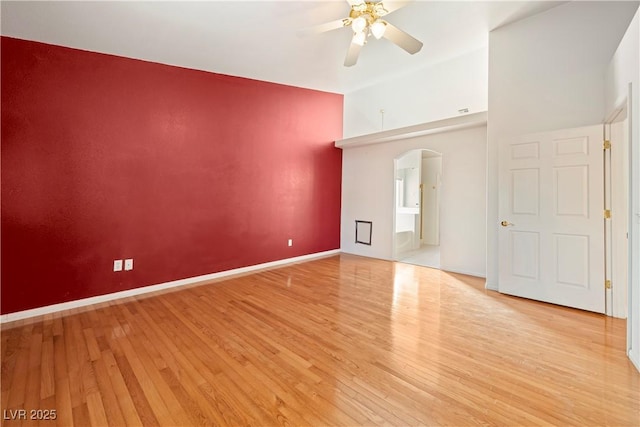 unfurnished room with ceiling fan and light wood-type flooring