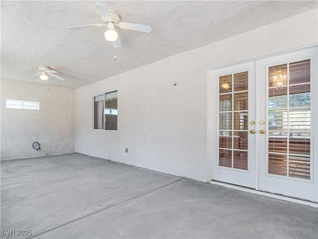 view of patio / terrace featuring ceiling fan and french doors