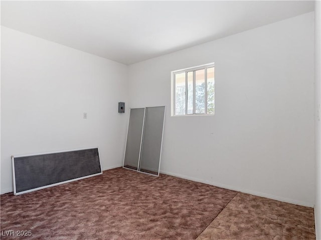 unfurnished room featuring carpet flooring