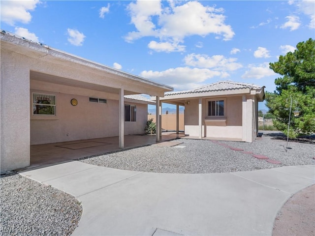 back of property featuring a patio