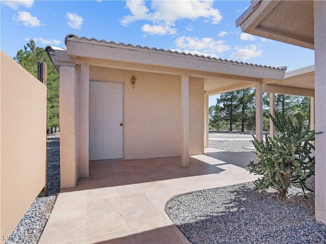 doorway to property with a patio