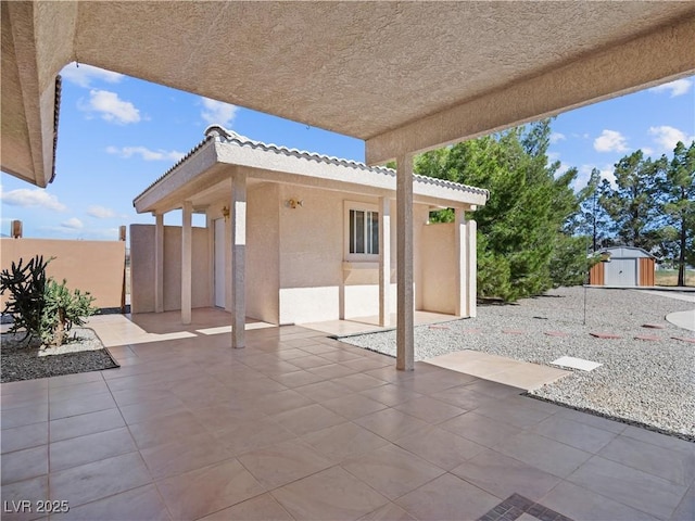 view of patio / terrace with a storage shed