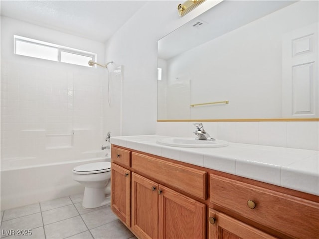 full bathroom featuring tile patterned flooring, vanity, toilet, and bathing tub / shower combination