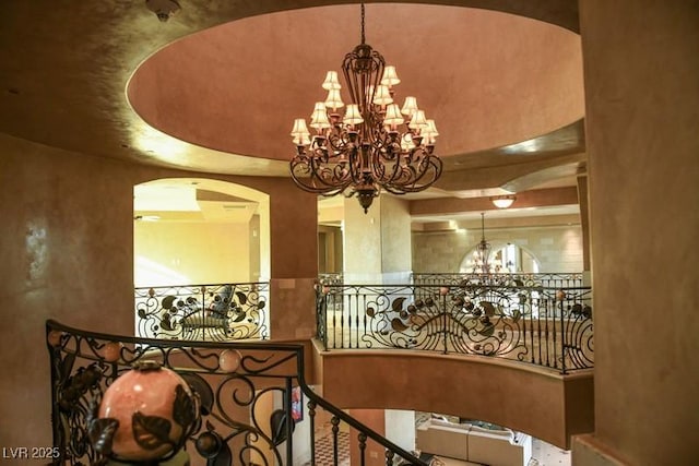 hallway featuring an inviting chandelier