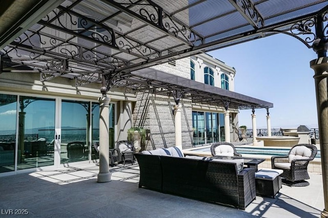 view of patio with an outdoor living space and a swimming pool