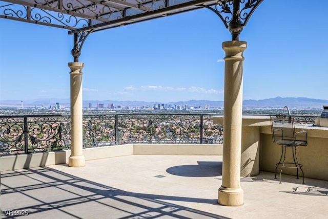 view of patio / terrace with a mountain view