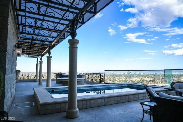 view of patio featuring a pool with hot tub