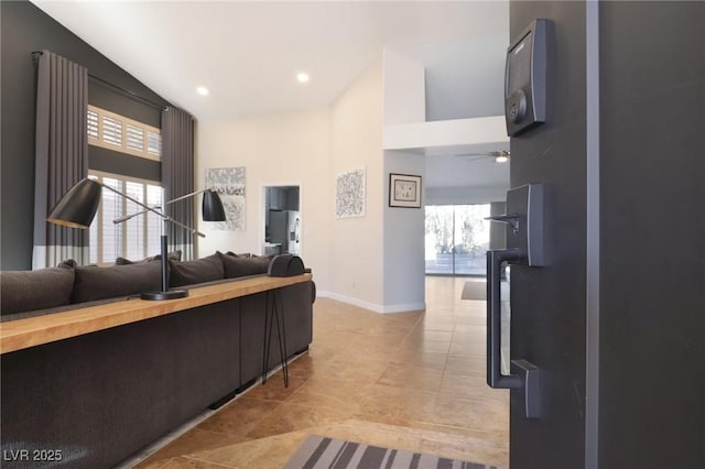 tiled living room featuring ceiling fan