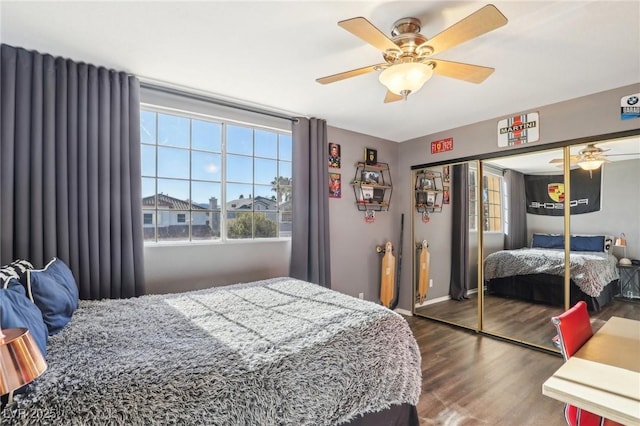 bedroom with a closet, ceiling fan, and hardwood / wood-style flooring