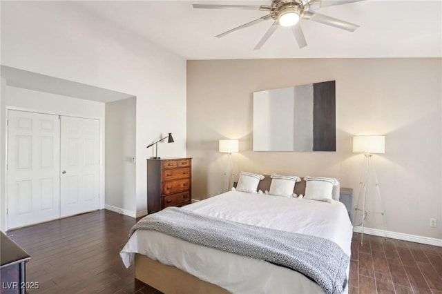 bedroom with ceiling fan, a closet, lofted ceiling, and dark hardwood / wood-style floors