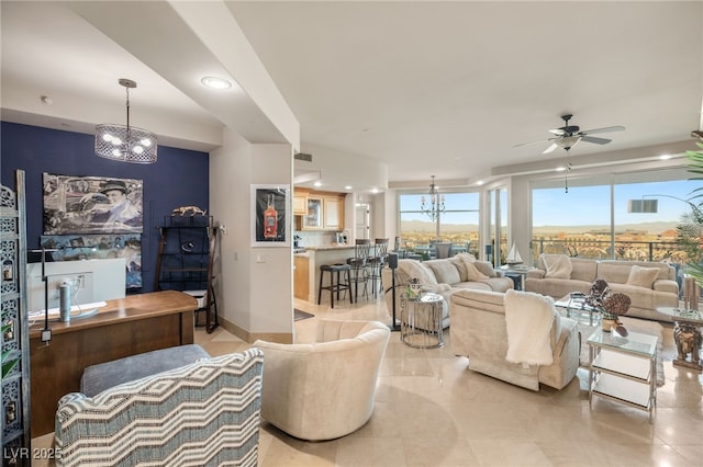 living room featuring light tile patterned floors and ceiling fan with notable chandelier