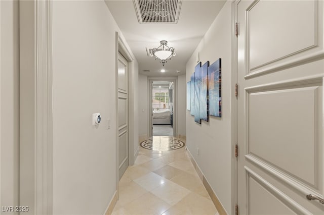 hallway with light tile patterned floors