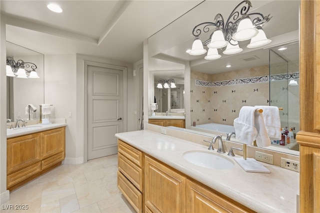 bathroom featuring vanity, plus walk in shower, and a chandelier