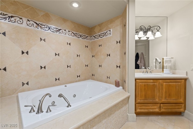 bathroom featuring vanity and tiled tub