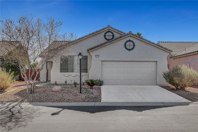 5919 Pavilion Lakes Ave, Las Vegas, NV 89122 - mediterranean / spanish-style house featuring an attached garage, concrete driveway, and stucco siding