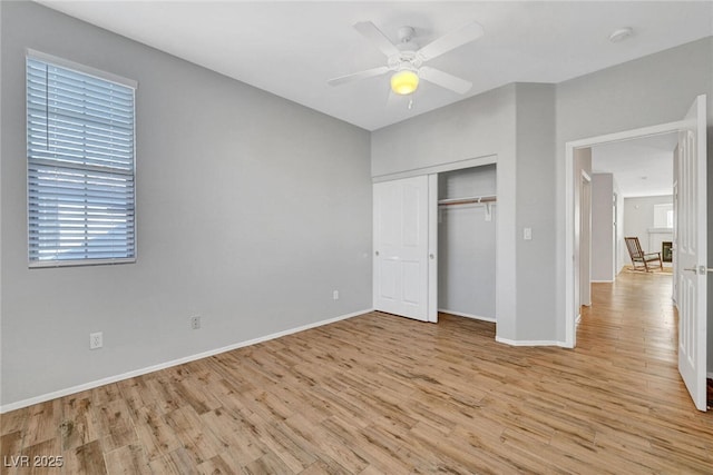 5919 Pavilion Lakes Ave, Las Vegas, NV 89122 - unfurnished bedroom with light wood finished floors, a closet, and a ceiling fan