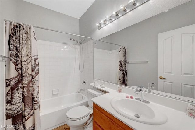 bathroom featuring vanity, toilet, and shower / tub combo