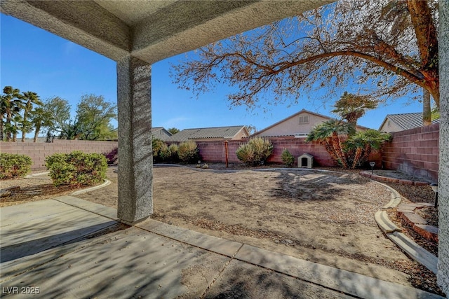 view of yard featuring a patio and a fenced backyard