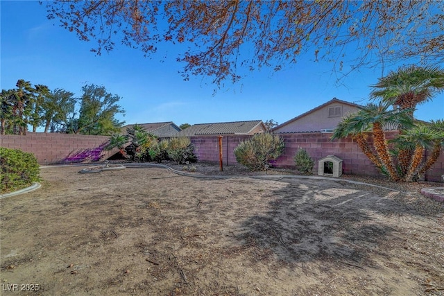 view of yard with a fenced backyard