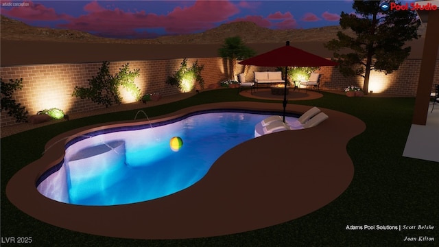 view of swimming pool featuring a mountain view, a fenced backyard, and a patio