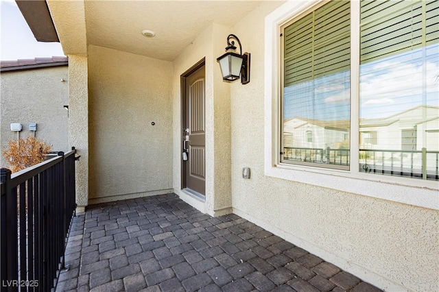 property entrance with a balcony