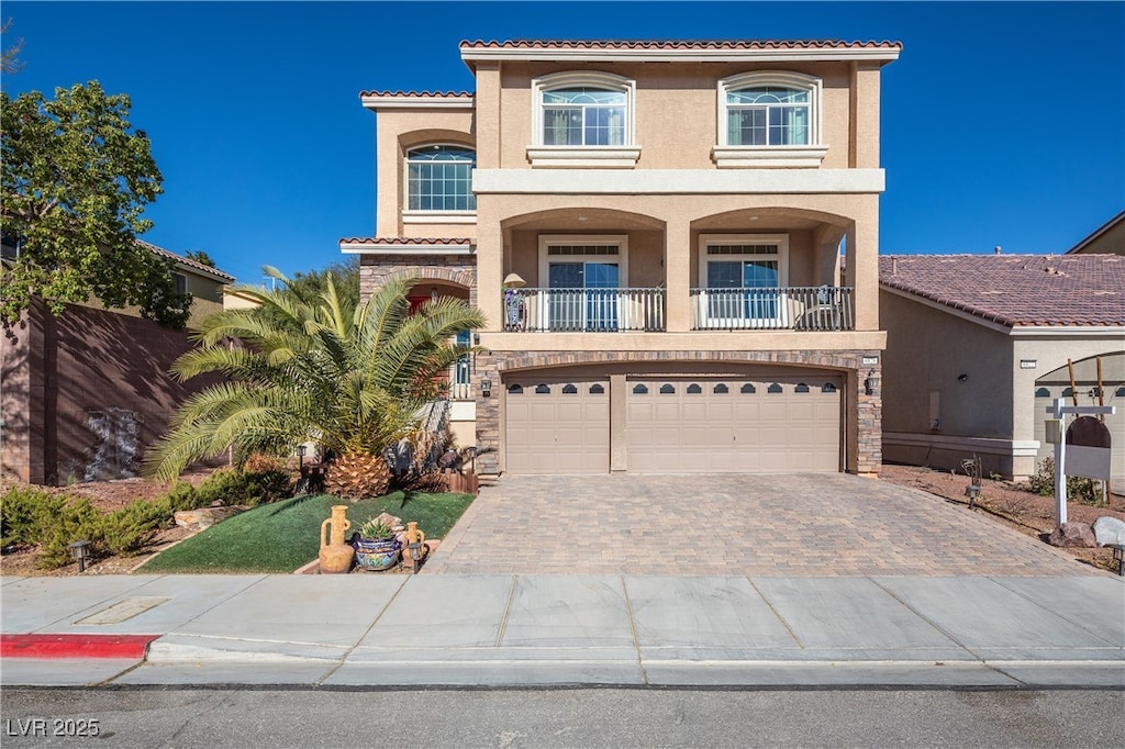 mediterranean / spanish-style home featuring a garage