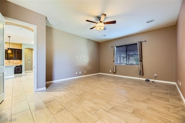 unfurnished room featuring ceiling fan