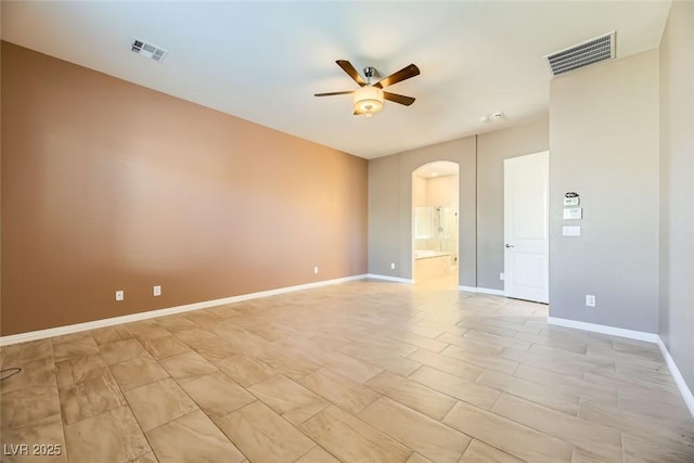 unfurnished room with ceiling fan