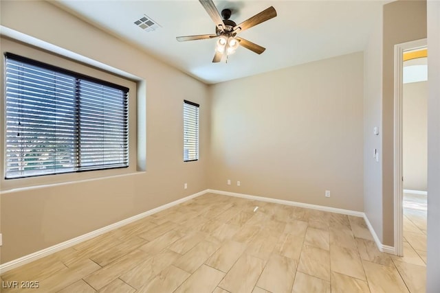 unfurnished room featuring ceiling fan and light hardwood / wood-style floors