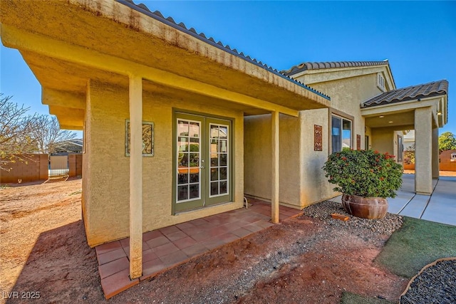 entrance to property featuring french doors