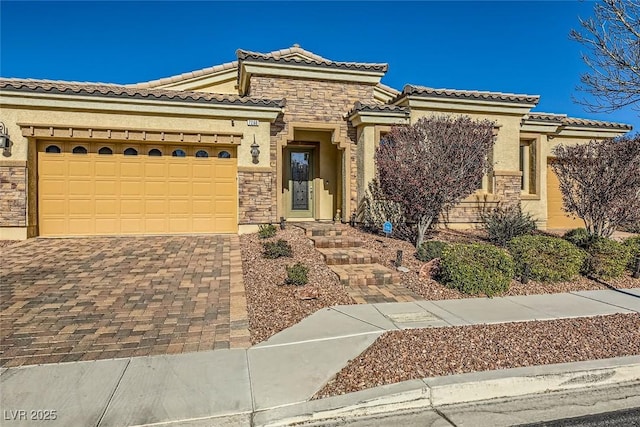 mediterranean / spanish-style home with a garage