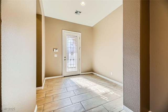 entryway featuring light tile patterned floors