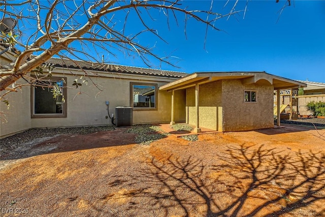 back of property featuring cooling unit