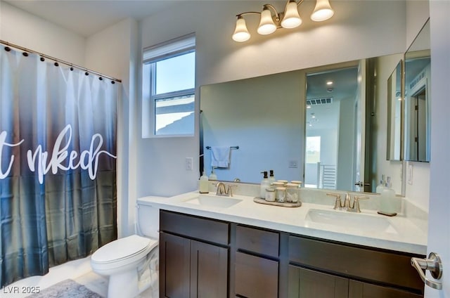 full bathroom with vanity, shower / bath combination with curtain, and toilet