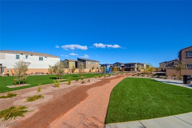 view of community featuring a yard