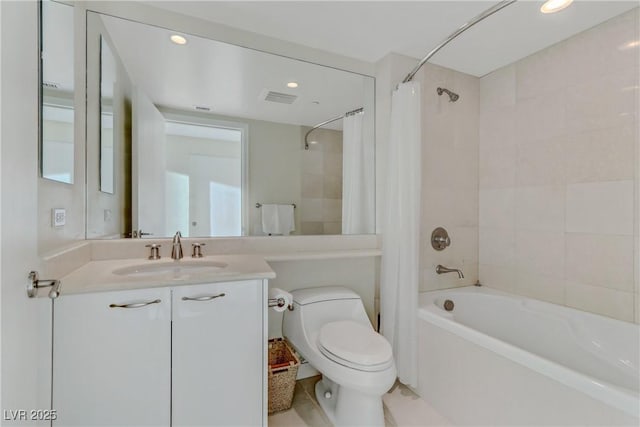 full bathroom with vanity, toilet, and shower / bath combo with shower curtain