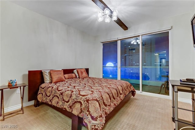 carpeted bedroom with ceiling fan and access to exterior