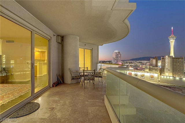 view of balcony at dusk