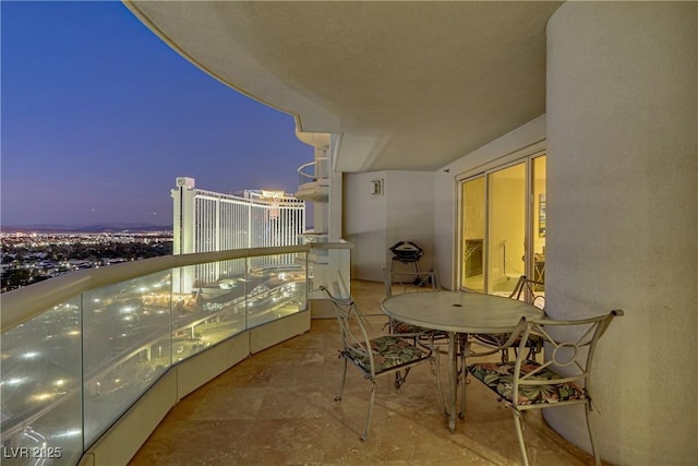 view of balcony at dusk