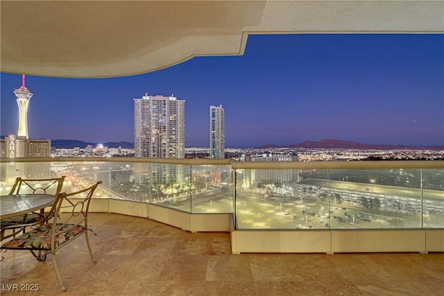 balcony at dusk with a mountain view