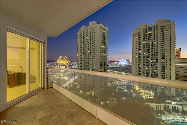 view of balcony at dusk